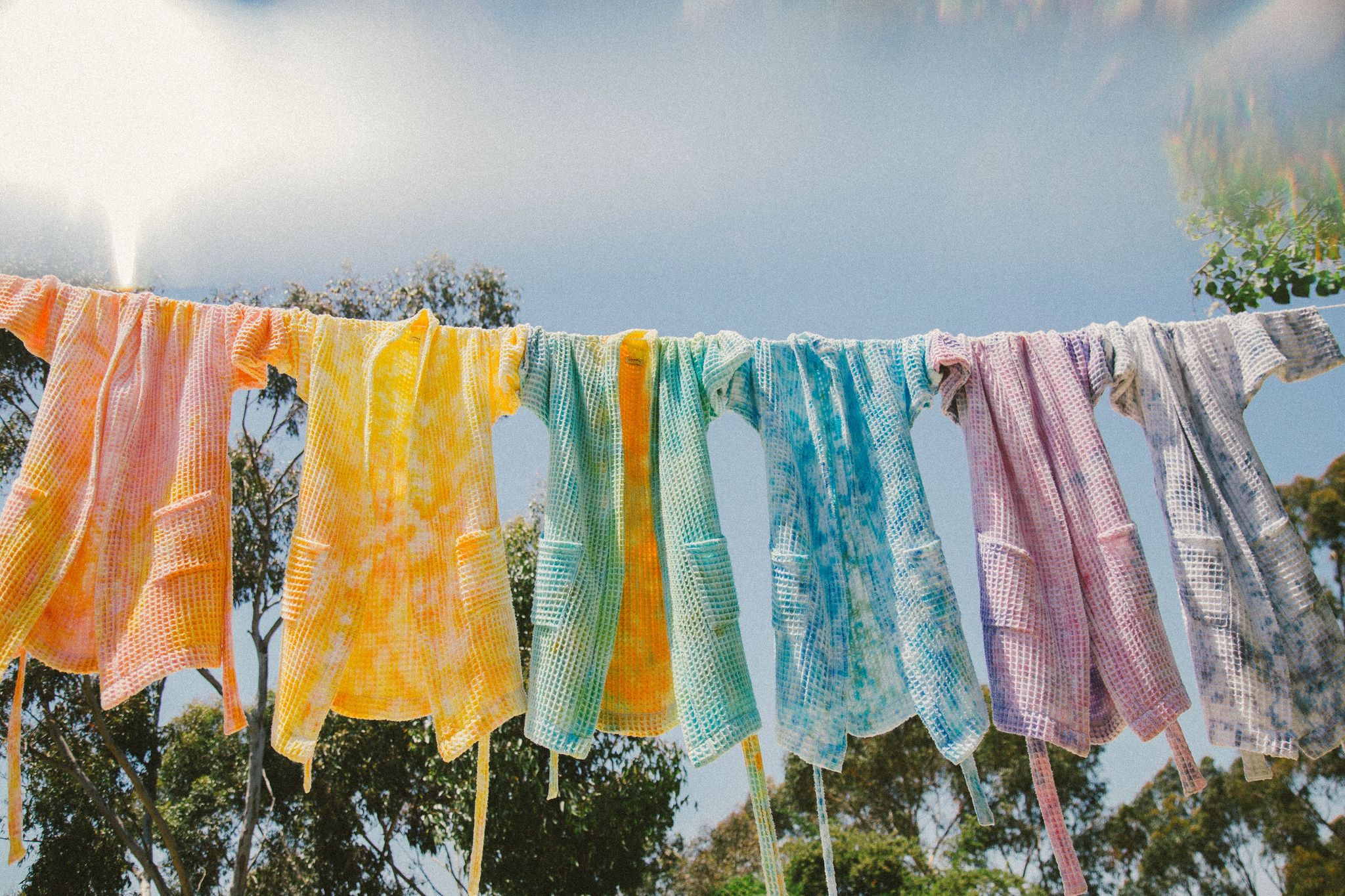 robes hanging on a clothesline