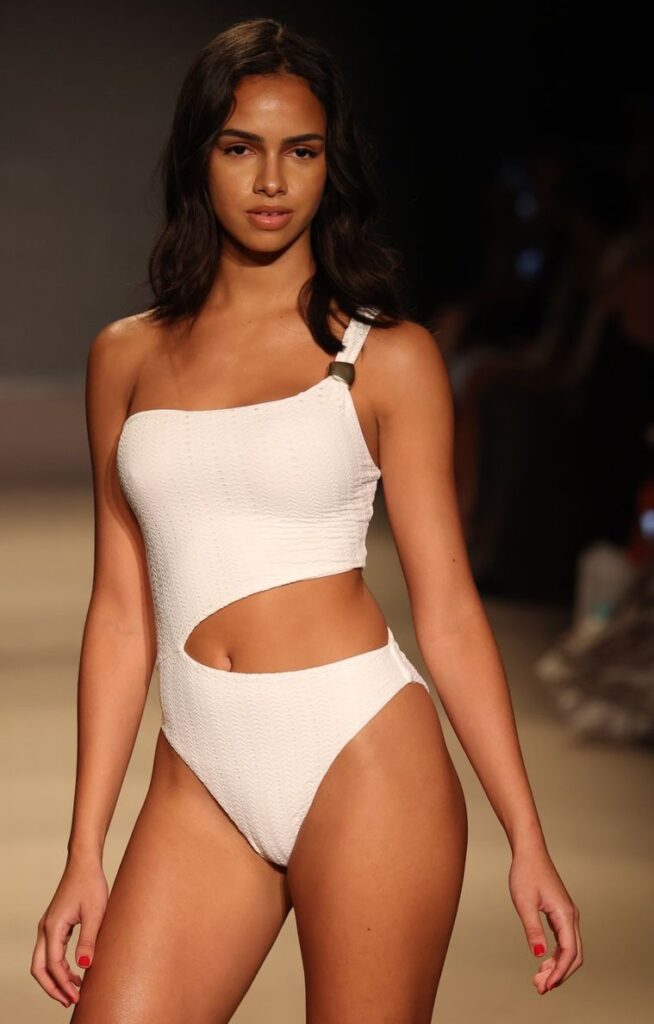 White one-shoulder swimsuit with a metal shoulder slider and a side cutout, Melissa Odabash runway at Paraiso Miami Swim Week 2026